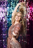 Portrait of a happy smiling girl in a stylish glamorous dress with sequins at a fashion party. royalty free stock photos Portrait of a happy smiling girl in a stylish glamorous dress with sequins at a fashion party. royalty free stock photos