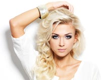 Beautiful Blond Woman With Long Curly Hair And Style Makeup. Royalty Free Stock Photo