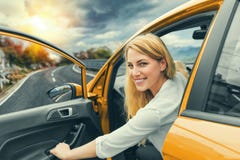 Beautiful Blonde Girl Driving A Car On The Highway. Invitation To Travel. Car Rental Or Vacation. Stock Photos Beautiful Blonde Girl Driving A Car On The Highway. Invitation To Travel. Car Rental Or Vacation. Stock Photos