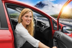 Beautiful Blonde Girl Driving A Car On The Highway. Invitation To Travel. Car Rental Or Vacation. Stock Photo Beautiful Blonde Girl Driving A Car On The Highway. Invitation To Travel. Car Rental Or Vacation. Stock Photo
