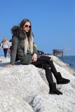 Beautiful blonde girl, model, walks near the sea. La Diga, Veneto, Italy. royalty free stock photo Beautiful blonde girl, model, walks near the sea. La Diga, Veneto, Italy. royalty free stock photo