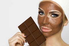 Beautiful blonde woman with a facial mask, beauty spa.Chocolate face mask royalty free stock photography Beautiful blonde woman with a facial mask, beauty spa.Chocolate face mask royalty free stock photography