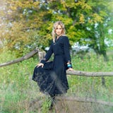 Beautiful Blonde Woman In Black Dress Royalty Free Stock Photography
