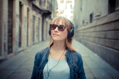 Beautiful Blonde Woman Listening To Music Stock Image