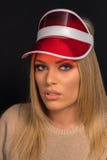 Beautiful blonde woman with red plastic visor cap royalty free stock image Beautiful blonde woman with red plastic visor cap royalty free stock image
