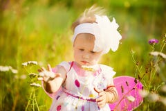 Beautiful carefree girl playing outdoors in field with high gree stock photos Beautiful carefree girl playing outdoors in field with high gree stock photos