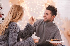 Beautiful caring woman feeding her boyfriend Stock Photos Beautiful caring woman feeding her boyfriend Stock Photos