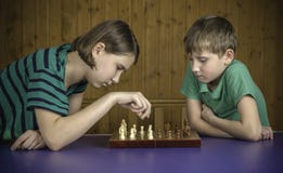Beautiful Children Playing Chess Stock Image