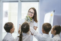 Beautiful children school children with flowers for the teachers
