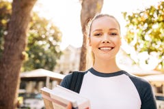 Beautiful college student smiling outdoors royalty free stock photo Beautiful college student smiling outdoors royalty free stock photo