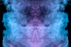 The beautiful color combination of blue, pink, violet and red hues from the substance is smoke, on a black background resembling stock image The beautiful color combination of blue, pink, violet and red hues from the substance is smoke, on a black background resembling stock image