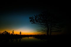 A beautiful, colorful, artistic landscape of a marsh in sunrise stock image A beautiful, colorful, artistic landscape of a marsh in sunrise stock image