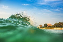 Beautiful colorful ocean wave crashing closing near sand beach Royalty Free Stock Photo Beautiful colorful ocean wave crashing closing near sand beach Royalty Free Stock Photo