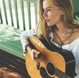 Beautiful country girl with her guitar stock images Beautiful country girl with her guitar stock images