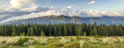 Beautiful dramatic white clouds over mountains. Forest hills in. Carpathian mountains. Ukraine Royalty Free Stock Photo Beautiful dramatic white clouds over mountains. Forest hills in. Carpathian mountains. Ukraine Royalty Free Stock Photo