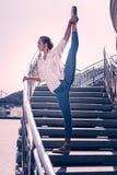 Beautiful elegant woman dancing on the stairs stock photo Beautiful elegant woman dancing on the stairs stock photo