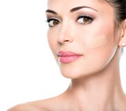 Beautiful face of woman with cosmetic foundation on a skin. Stock Photo Beautiful face of woman with cosmetic foundation on a skin. Stock Photo