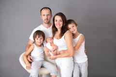 Beautiful Family Portrait, Father, Mother And Three Boys, Looking Happily At Camera Royalty Free Stock Photos