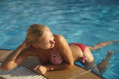 Beautiful Fashionable And Blonde Girl In Bikini Pose In Swimming Pool Stock Photo Beautiful Fashionable And Blonde Girl In Bikini Pose In Swimming Pool Stock Photo