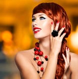 Beautiful fashionable woman with red nails and red hairs stock photography Beautiful fashionable woman with red nails and red hairs stock photography