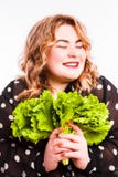Beautiful fat young woman with bright emotions on a light gray background. Concept of diet. Space for text. stock images Beautiful fat young woman with bright emotions on a light gray background. Concept of diet. Space for text. stock images