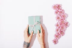 Beautiful female hands hold the blue box with a gift royalty free stock photo Beautiful female hands hold the blue box with a gift royalty free stock photo
