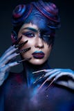 Beautiful girl with art fashion make up, creative hairstyle, long nails. Design manicure. Beauty face. stock photos Beautiful girl with art fashion make up, creative hairstyle, long nails. Design manicure. Beauty face. stock photos
