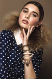 Beautiful girl with classic make-up and hairstyle art, clothing retro style. Beauty face stock photography Beautiful girl with classic make-up and hairstyle art, clothing retro style. Beauty face stock photography