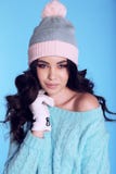 Beautiful girl with curly hair in warm cozy winter clothes Royalty Free Stock Photos Beautiful girl with curly hair in warm cozy winter clothes Royalty Free Stock Photos
