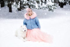 Beautiful girl with a dog on a walk in the winter forest. beautiful girl and her pet stock photos Beautiful girl with a dog on a walk in the winter forest. beautiful girl and her pet stock photos