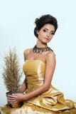 Beautiful girl in golden dress