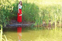 Beautiful Girl In A Long Red Skirt Royalty Free Stock Image