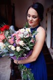 Beautiful girl with a large bouquet of flowers royalty free stock images Beautiful girl with a large bouquet of flowers royalty free stock images