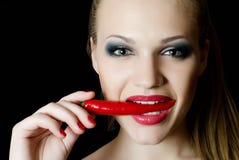 The beautiful girl with pepper chili Stock Image The beautiful girl with pepper chili Stock Image
