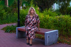 Beautiful girl sitting on a bench in the Park royalty free stock photos Beautiful girl sitting on a bench in the Park royalty free stock photos