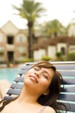 Beautiful Girl Sleeping On Side Of Pool Royalty Free Stock Photos
