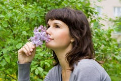 Beautiful Girl Smell The Lilacs Royalty Free Stock Photography