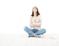 Beautiful girl teenager thinking sitting on floor. White background royalty free stock images Beautiful girl teenager thinking sitting on floor. White background royalty free stock images
