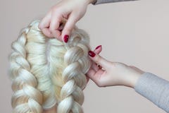 Beautiful Girl With Blonde Hair, Hairdresser Weaves A Braid Close-up, In A Beauty Salon. Royalty Free Stock Photos Beautiful Girl With Blonde Hair, Hairdresser Weaves A Braid Close-up, In A Beauty Salon. Royalty Free Stock Photos