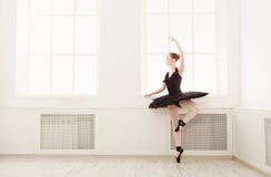 Beautiful graceful ballerina in black swan dress stock photos Beautiful graceful ballerina in black swan dress stock photos