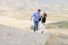 Beautiful happy smiling running couple in love stock photography Beautiful happy smiling running couple in love stock photography