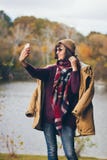 A beautiful happy smiling young woman in the autumn park Royalty Free Stock Photography A beautiful happy smiling young woman in the autumn park Royalty Free Stock Photography