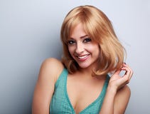 Beautiful happy young woman with blond short bob hair style. Closeup portrait