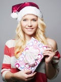 Beautiful happy young woman in Santa Claus hat royalty free stock photo Beautiful happy young woman in Santa Claus hat royalty free stock photo