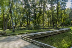 Beautiful image of a wooden walkway zigzag in the park on a sunny autumn day stock photography Beautiful image of a wooden walkway zigzag in the park on a sunny autumn day stock photography