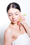 Beautiful lady with lilly flower. Perfect skin. stock photos Beautiful lady with lilly flower. Perfect skin. stock photos