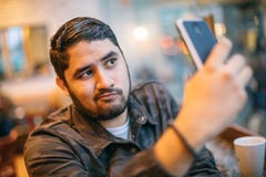 Beautiful Latin Man Posing Takes Selfie On Phone. Fun Online Dating Communication. Cheating Cool Face Royalty Free Stock Image