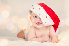 Beautiful Little Baby Celebrates Christmas New Year`s Holidays Baby Red Hat Boken Background Stock Photo