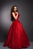 Beautiful long haired woman in red dress