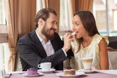 https://thumbs.dreamstime.com/t/beautiful-loving-couple-eating-restaurant-attractive-young-men-women-dating-cafe-sitting-table-59316442.jpg